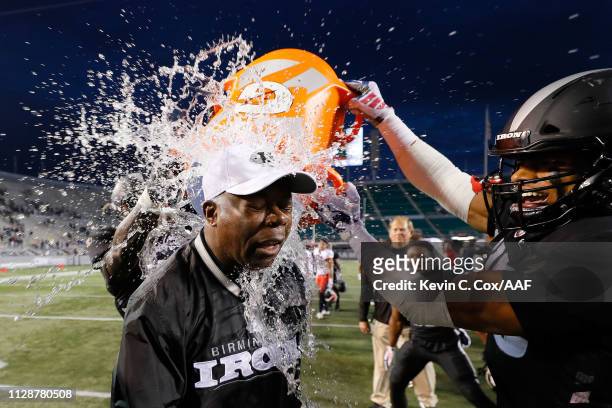 Water is dumped on head coach Tim Lewis of Birmingham Iron following a victory over the Memphis Express during an Alliance of American Football game...