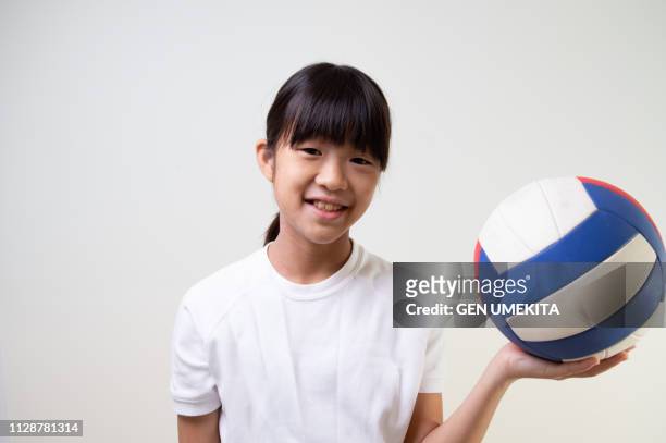 girl playing volleyball - japan 12 years girl stock pictures, royalty-free photos & images