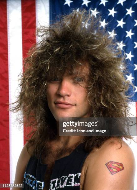 American singer-songwriter, actor and namesake of the rock band Bon Jovi poses for a portrait in front of the American flag, June in Detroit, MI.