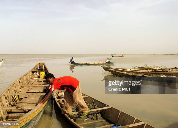 Eight-year-old Abba Moussa docks a boat at Sinyaka Island in Lake Chad. One of the largest lakes in the world, central Africa's Lake Chad, is drying...