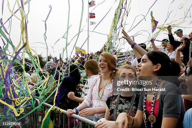 Mardi Gras Revelers are showered by streamers shot from City Hall on Tuesday, February 5 during the Gulf Coast Carnival Association/Neptune Mardi...