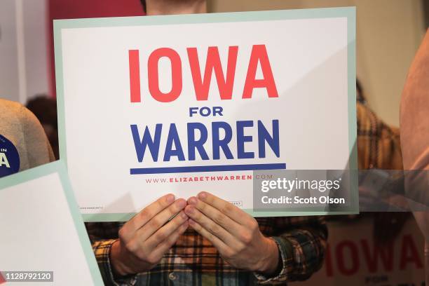 Guests listen as Sen. Elizabeth Warren speaks at a campaign rally at the University of Iowa on February 10, 2019 in Iowa City, Iowa. Warren is making...