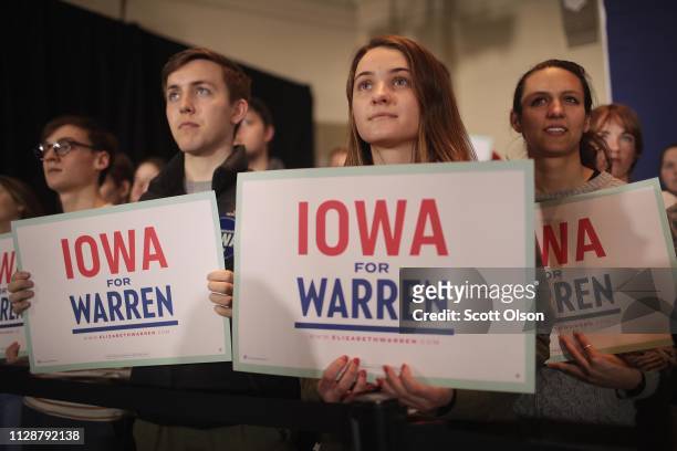 Guests listen as Sen. Elizabeth Warren speaks at a campaign rally at the University of Iowa on February 10, 2019 in Iowa City, Iowa. Warren is making...
