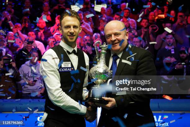 Judd Trump of England poses with the trophy after winning the final match against Ali Carter of England on day 7 of the 2019 Coral World Grand Prix...