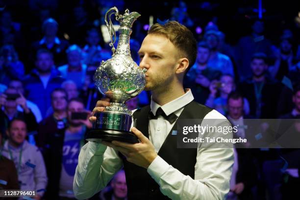Judd Trump of England kisses the trophy after winning the final match against Ali Carter of England on day 7 of the 2019 Coral World Grand Prix at...