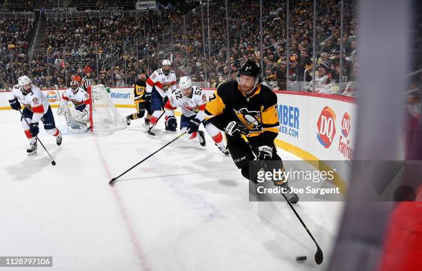 Matt Cullen of the Pittsburgh Penguins handles the puck in his 1500th NHL game against the Florida Panthers at PPG Paints Arena on March 5, 2019 in...