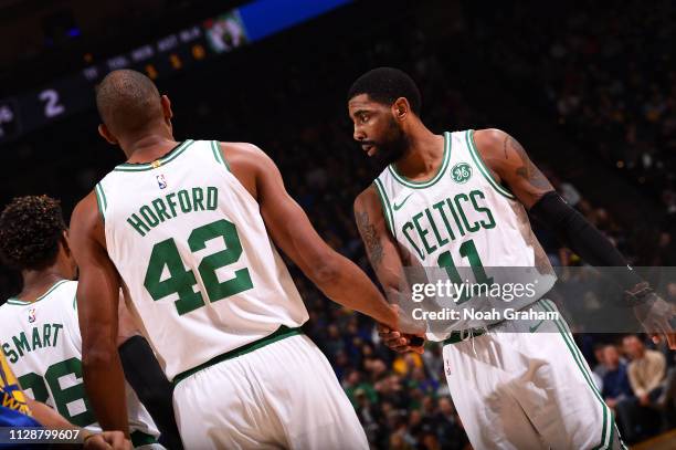 Al Horford shakes hands with Kyrie Irving of the Boston Celtics on March 5, 2019 at ORACLE Arena in Oakland, California. NOTE TO USER: User expressly...