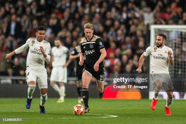 Casemiro of Real Madrid , Frenkie de Jong of Ajax and Dani Carvajal of Real Madrid battle for the ball during the UEFA Champions League Round of 16...