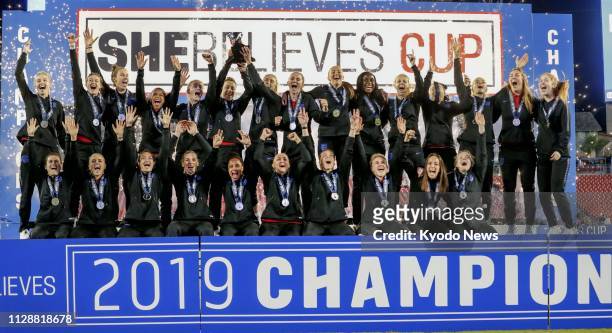 England players celebrate after winning the SheBelieves Cup in Tampa, Florida, on March 5, 2019. ==Kyodo