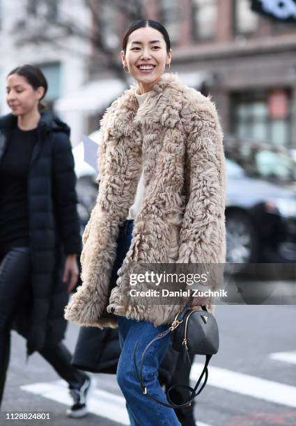 Liu Wen is seen wearing a fur coat and blue jeans with a Prada bag outside the Sies Marjan show during New York Fashion Week: Fall/Winter 2019 on...