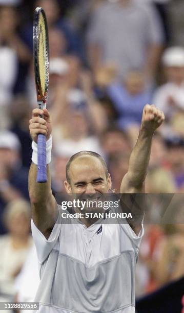 Number two seeded Andre Agassi, of the US, celebrates his victory over compatriot and number seven seeded Todd Martin 12 September, 1999 at the US...