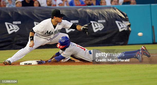 Chicago Cubs Alfonso Soriano steals third base on Florida Marlins Jorge Cantu during the third inning at the Dolphin Stadium in Miami, Florida, on...
