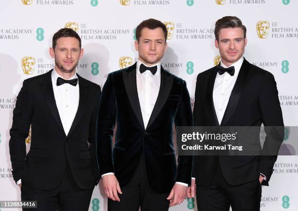 Jamie Bell, Taron Egerton and Richard Madden pose in the press room during the EE British Academy Film Awards at Royal Albert Hall on February 10,...