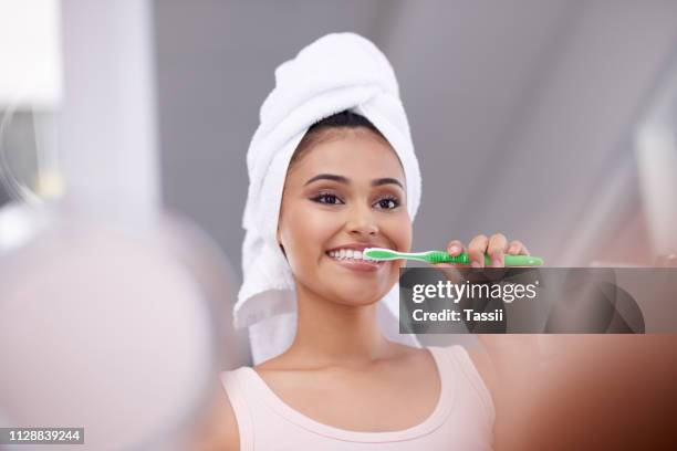 do it twice a day for good oral health - adult in mirror stock pictures, royalty-free photos & images