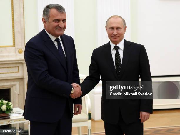 Russian President Vladimir Putin greets South Ossetian leader Anatoly Bibilov during their talks at the Kremlin on March 6 2019, in Moscow, Russia....