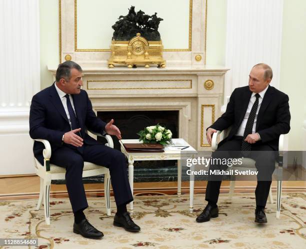 Russian President Vladimir Putin listens to South Ossetian leader Anatoly Bibilov during their talks at the Kremlin on March 6 2019, in Moscow,...