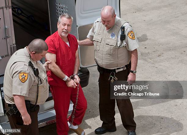 Drew Peterson is escorted on Friday, May 8 to the Will County Courthouse for an arraignment hearing in Joliet, Illinois. Peterson is being charged...