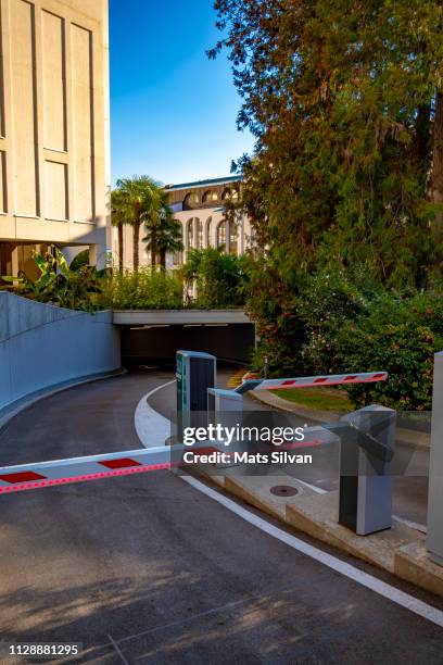 boom barrier to underground parking garage - boom barrier stock pictures, royalty-free photos & images