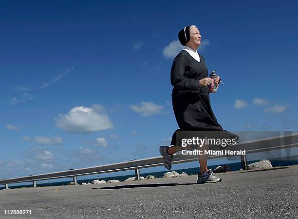 Sister Mary Elizabeth Lloyd runs on Thursday, May 14 in Key Largo, Florida, as she prepares for a 100-mile marathon through the Florida Keys.