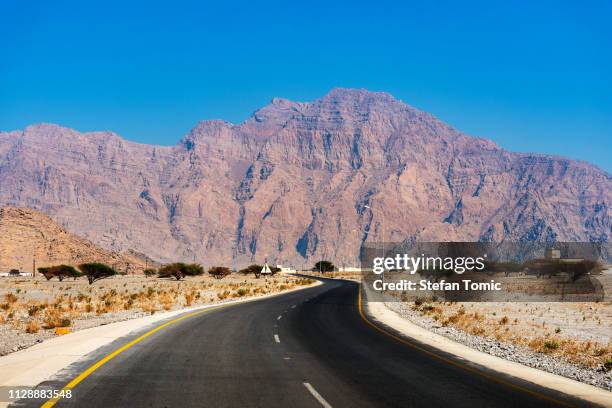 scenic desert road in oman - desert road stock pictures, royalty-free photos & images
