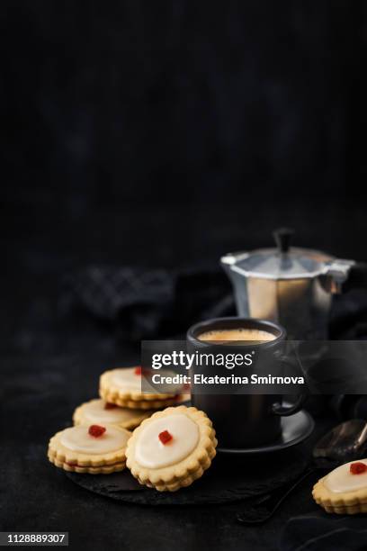 empire shortbread sandwich cookies and cup of coffee - englische tea time stock-fotos und bilder