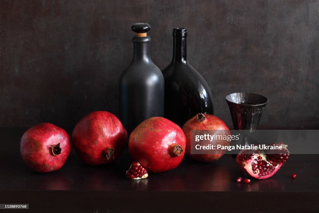 Pomegranates and Black Bottles