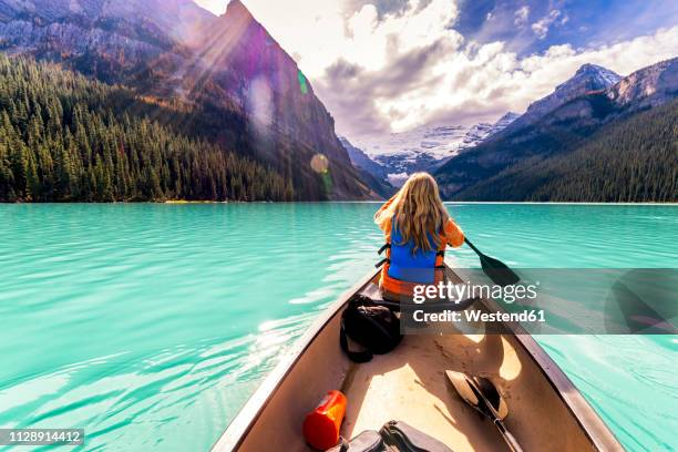 canada, alberta, banff national park, canoeing on lake louise - lake louise ストックフォトと画像