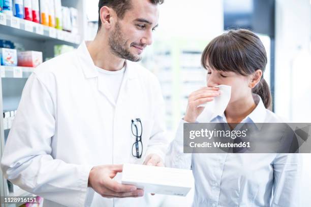 pharmacist advising customer in pharmacy - allergy medicine stock pictures, royalty-free photos & images