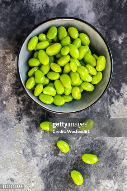 edamame, soy beans in bowl - edamame stock pictures, royalty-free photos & images