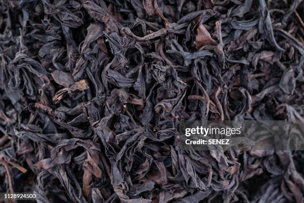 black dry tea leaves close up for background - 中国茶 ストックフォトと画像