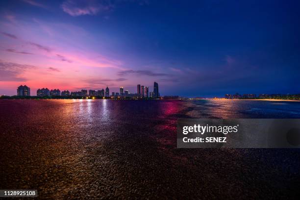 rainy ground，parking lot - city street sunset stock pictures, royalty-free photos & images