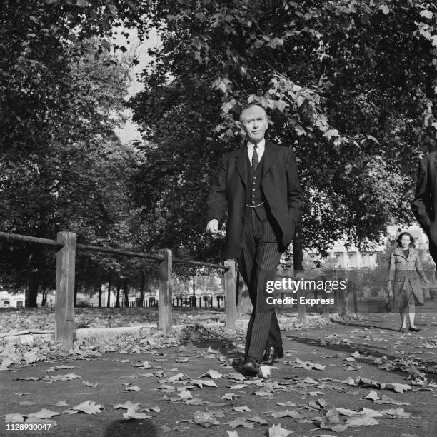 British Conservative politician and Prime Minister of the United Kingdom Alec Douglas-Home walking in a park, London, UK, 21st October 1963.
