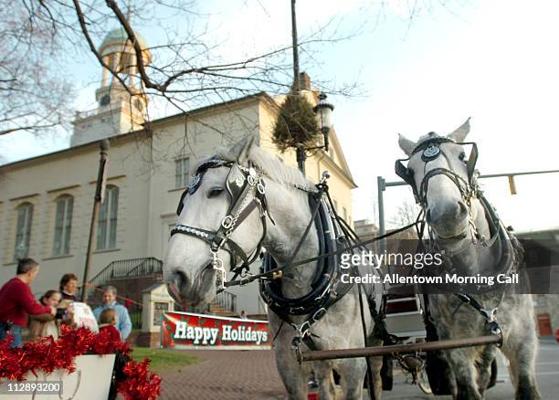 Horse drawn carriage waits for passengers in front of the Central Moravian Church in Bethlehem, Pennsylvania, on Thursday, December 22, 2006.