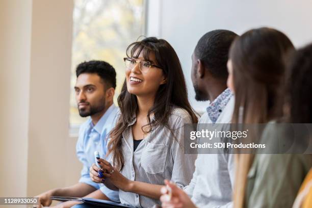 design professional speaks during training lesson - group learning stock pictures, royalty-free photos & images