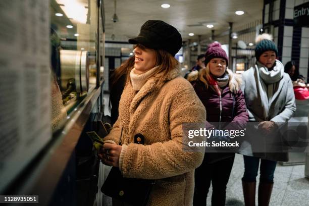 paying for a subway ticket - ticket counter stock pictures, royalty-free photos & images