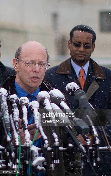 Michael Ratner, President, Center for Constitutional Rights speaks outside the U.S. Supreme Court as Vincent Warren, Executive Director, Center for...