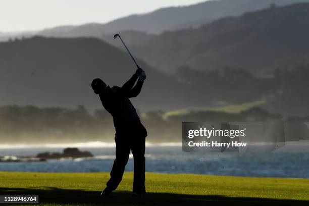 Paul Casey of England plays his second shot on the 18th hole during the continuation of the final round of the AT&T Pebble Beach Pro-Am at Pebble...