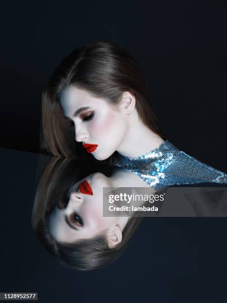 woman looking at her mirror reflection - personagem mitológica imagens e fotografias de stock