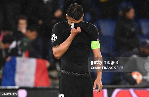 Paris Saint-Germain's Brazilian defender Thiago Silva reacts at the end of the UEFA Champions League round of 16 second-leg football match between...