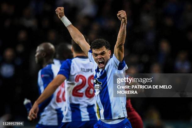 Porto's defender Pepe celebrates during the UEFA Champions League round of 16 second leg football match between FC Porto and AS Roma at the Dragao...