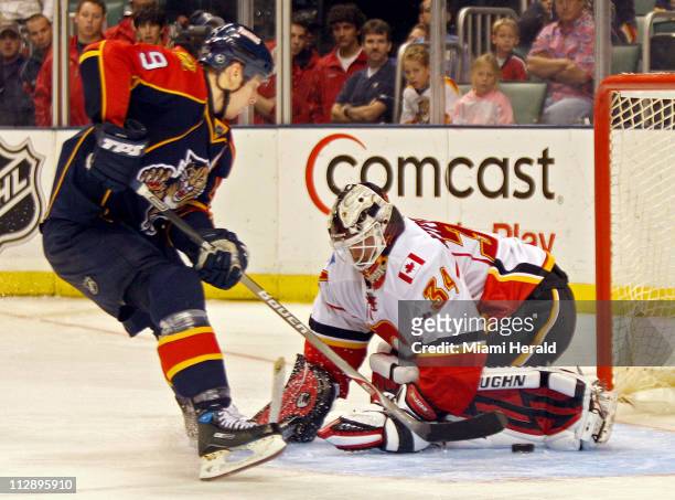 Calgary Flames goalie Miikka Kiprusoff stops Florida Panthers' Stephen Weiss on the last chance in the shootout at the Bank Atlantic Center in...