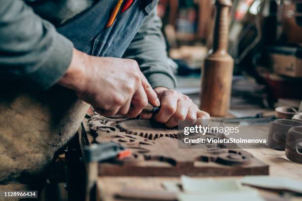 applying the finishing touches - carving craft activity stock pictures, royalty-free photos & images