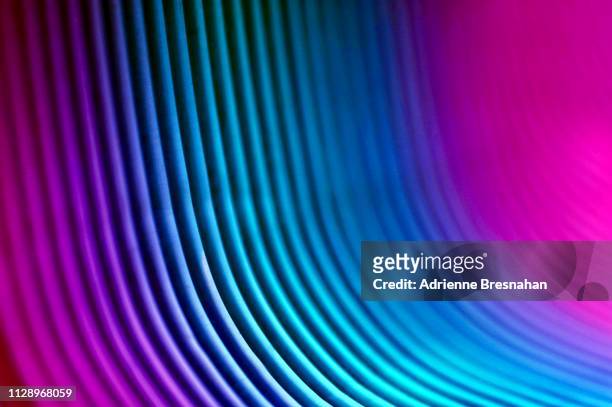 glowing curved neon stripes - fibre stock pictures, royalty-free photos & images