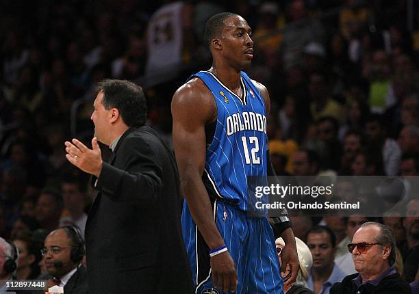 Orlando Magic head coach Stan Van Gundy yells as center Dwight Howard comes to the bench during the second quarter against the Los Angeles Lakers in...