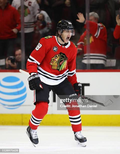 Patrick Kane of the Chicago Blackhawks celebrates after scoring a goal in the third period against the Detroit Red Wings at the United Center on...