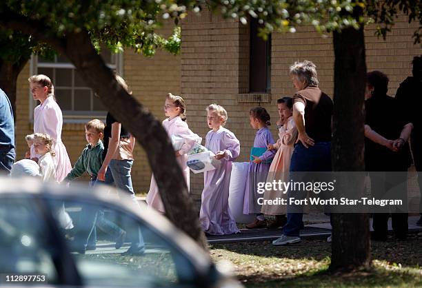 Women and children from the YFZ Ranch, the compound built by polygamist leader Warren Jeffs, are moved by bus to San Angelo, Texas, on Sunday, April...