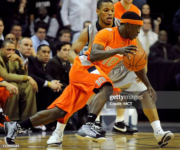 Syracuse guard Jonny Flynn drives on Georgetown defender Chris Wright during second half action at the Verizon Center in Washington, D.C., Wednesday,...