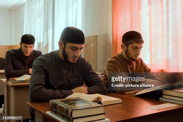 October 2018, Russia, Grosny: Students of the Islamic University read from the Koran. Photo: Emile Ducke/A4897/Emile Ducke
