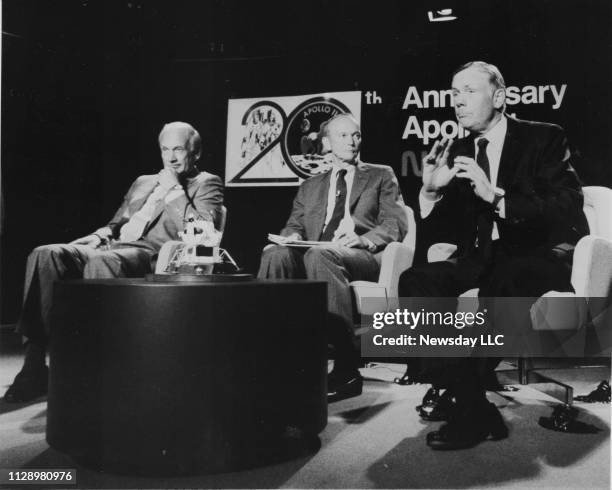 Apollo 11 astronauts Buzz Aldin, left, Michael Collins and Neil Armstrong, right, answer questions about the upcoming 20th anniversary of the lunar...