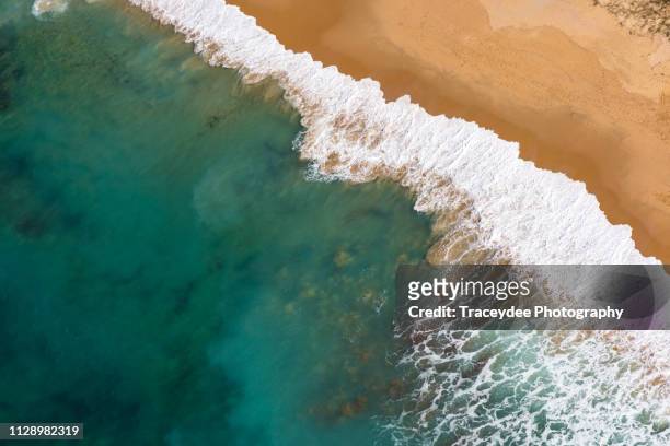 aerial view of a beach in caloundra, sunshine coast with turquoise coloured water, sea foam and golden sand - caloundra stock pictures, royalty-free photos & images